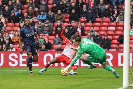 Photo for Sol Brynn of Leyton Orientsaves a shot from Devante Cole of Barnsley during the Sky Bet League 1 match Barnsley vs Leyton Orient at Oakwell, Barnsley, United Kingdom, 10th February 202 - Royalty Free Image