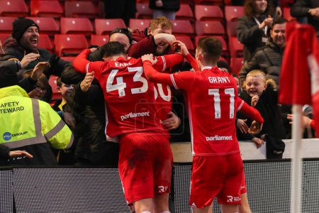 Photo for Adam Phillips of Barnsley celebrates his goal to make it 2-1 during the Sky Bet League 1 match Barnsley vs Leyton Orient at Oakwell, Barnsley, United Kingdom, 10th February 202 - Royalty Free Image