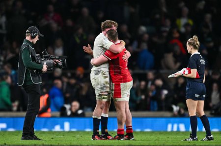 Photo for Club team mate Ollie Chessum of England and Tommy Reffell of Wales embrace at the end of the 2024 Guinness 6 Nations match England vs Wales at Twickenham Stadium, Twickenham, United Kingdom, 10th February 202 - Royalty Free Image