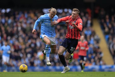 Photo for Erling Haaland of Manchester City is challenged by Jarrad Branthwaite of Everton during the Premier League match Manchester City vs Everton at Etihad Stadium, Manchester, United Kingdom, 10th February 202 - Royalty Free Image