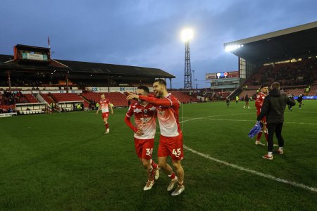 Photo for John Mcatee of Barnsley and double goal hero Adam Phillips of Barnsley celebrate with the fans during the Sky Bet League 1 match Barnsley vs Leyton Orient at Oakwell, Barnsley, United Kingdom, 10th February 202 - Royalty Free Image