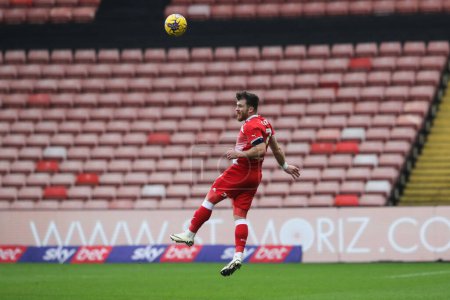 Photo for Nicky Cadden of Barnsley heads the ball during the Sky Bet League 1 match Barnsley vs Leyton Orient at Oakwell, Barnsley, United Kingdom, 10th February 202 - Royalty Free Image