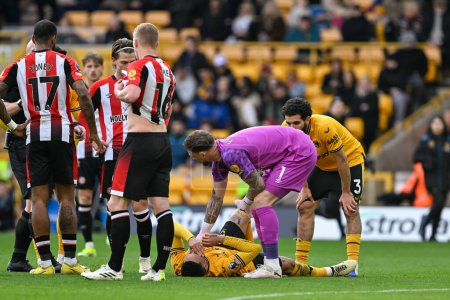 Photo for Matheus Cunha of Wolverhampton Wanderers goes down with an injury, during the Premier League match Wolverhampton Wanderers vs Brentford at Molineux, Wolverhampton, United Kingdom, 10th February 202 - Royalty Free Image