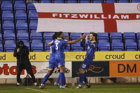 Photo for Tom Bayliss of Shrewsbury Town celebrates an own goal from Nicky Cadden of Barnsley during the Sky Bet League 1 match Shrewsbury Town vs Barnsley at Croud Meadow, Shrewsbury, United Kingdom, 13th February 202 - Royalty Free Image