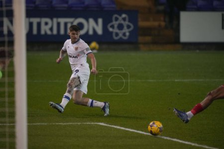 Photo for Harvey Saunders of Tranmere Rovers crosses the ball during the Sky Bet League 2 match Tranmere Rovers vs Morecambe at Prenton Park, Birkenhead, United Kingdom, 13th February 202 - Royalty Free Image