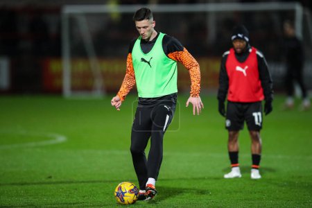 Photo for Oliver Casey of Blackpool during the pre-game warm up ahead of the Sky Bet League 1 match Cheltenham Town vs Blackpool at The Completely-Suzuki Stadium, Cheltenham, United Kingdom, 13th February 202 - Royalty Free Image