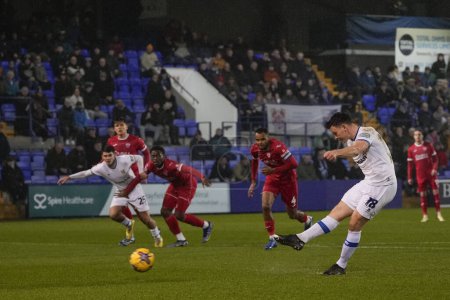 Photo for Connor Jennings of Tranmere Rovers scores from the penalty spot to make it 2-0 during the Sky Bet League 2 match Tranmere Rovers vs Morecambe at Prenton Park, Birkenhead, United Kingdom, 13th February 202 - Royalty Free Image
