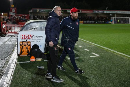 Photo for Neil Critchley manager of Blackpool and Kevin Russell manager of Cheltenham Town during the Sky Bet League 1 match Cheltenham Town vs Blackpool at The Completely-Suzuki Stadium, Cheltenham, United Kingdom, 13th February 202 - Royalty Free Image