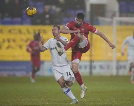 Photo for Chris Stokes of Morecambe clears the ball during the Sky Bet League 2 match Tranmere Rovers vs Morecambe at Prenton Park, Birkenhead, United Kingdom, 13th February 202 - Royalty Free Image