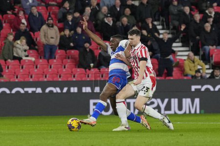 Photo for Luke McNally of Stoke City competes for the ball with Sinclair Armstrong of QPRduring the Sky Bet Championship match Stoke City vs Queens Park Rangers at Bet365 Stadium, Stoke-on-Trent, United Kingdom, 14th February 202 - Royalty Free Image