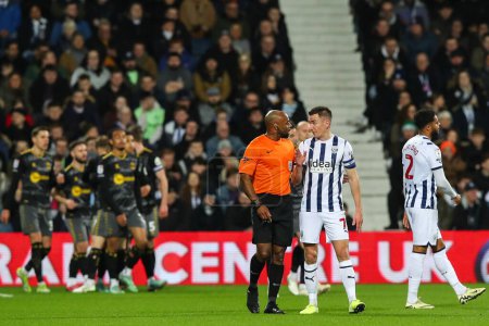 Photo for Jed Wallace of West Bromwich Albion talks with referee Samuel Allison during the Sky Bet Championship match West Bromwich Albion vs Southampton at The Hawthorns, West Bromwich, United Kingdom, 16th February 202 - Royalty Free Image