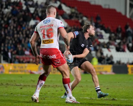 Photo for James Meadows of London Broncos passes the ball during the Betfred Super League Round 1 match St Helens vs London Broncos at Totally Wicked Stadium, St Helens, United Kingdom, 16th February 202 - Royalty Free Image