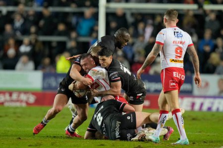 Photo for Dean Parata of London Broncos tackles Curtis Sironen of St. Helens during the Betfred Super League Round 1 match St Helens vs London Broncos at Totally Wicked Stadium, St Helens, United Kingdom, 16th February 202 - Royalty Free Image