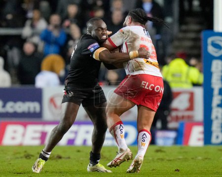 Photo for Sadiq Adebiyi of London Broncostackles Konrad Hurrell of St. Helens during the Betfred Super League Round 1 match St Helens vs London Broncos at Totally Wicked Stadium, St Helens, United Kingdom, 16th February 202 - Royalty Free Image