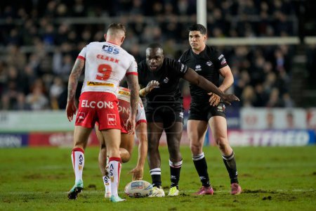 Photo for Sadiq Adebiyi of London Broncos and Dean Parata of London Broncos at a play the ball during the Betfred Super League Round 1 match St Helens vs London Broncos at Totally Wicked Stadium, St Helens, United Kingdom, 16th February 202 - Royalty Free Image