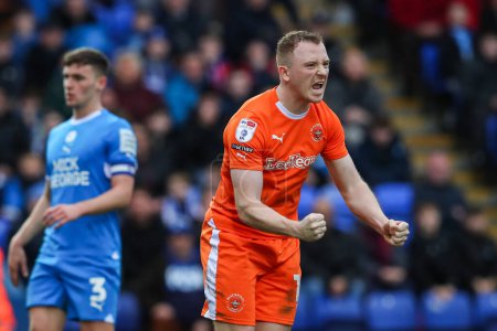 Photo for Shayne Lavery of Blackpool celebrates his goal to make it 1-1 during the Sky Bet League 1 match Peterborough United vs Blackpool at Weston Homes Stadium, Peterborough, United Kingdom, 17th February 202 - Royalty Free Image