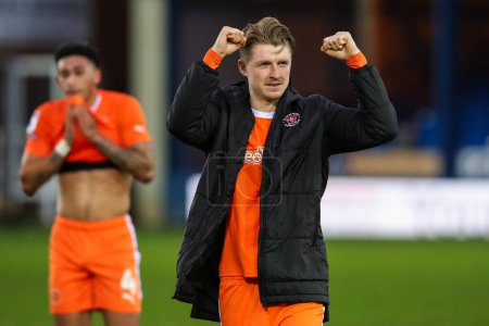 Photo for George Byers of Blackpool celebrates his teams win after the Sky Bet League 1 match Peterborough United vs Blackpool at Weston Homes Stadium, Peterborough, United Kingdom, 17th February 202 - Royalty Free Image