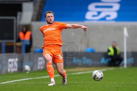 Photo for Matthew Pennington of Blackpool passes the ball during the Sky Bet League 1 match Peterborough United vs Blackpool at Weston Homes Stadium, Peterborough, United Kingdom, 17th February 202 - Royalty Free Image