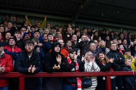 Photo for Barnsley fans sing and applaud on the 12th minute for Beth Sefton a member of the Barnsley staff 12 months after her illness during the Sky Bet League 1 match Fleetwood Town vs Barnsley at Highbury Stadium, Fleetwood, United Kingdom, 17th February 20 - Royalty Free Image