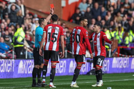 Photo for Referee Stuart Attwell gives a red card to Mason Holgate of Sheffield United during the Premier League match Sheffield United vs Brighton and Hove Albion at Bramall Lane, Sheffield, United Kingdom, 18th February 202 - Royalty Free Image