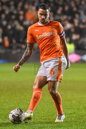 Photo for Oliver Norburn of Blackpool passes the ball during the Bristol Street Motors Trophy Semi-Final match Blackpool vs Peterborough United at Bloomfield Road, Blackpool, United Kingdom, 20th February 202 - Royalty Free Image