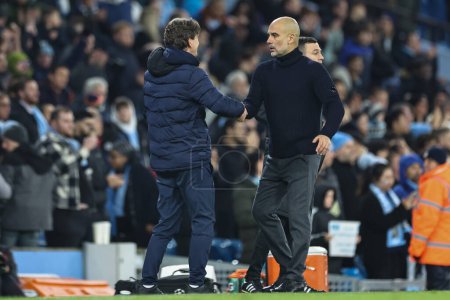 Photo for Pep Guardiola manager of Manchester City shakes hands with Thomas Frank manager of Brentford after Manchester City win 1-0 during the Premier League match Manchester City vs Brentford at Etihad Stadium, Manchester, United Kingdom, 20th February 202 - Royalty Free Image