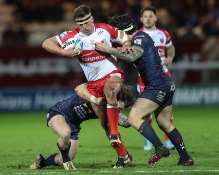 Photo for Jai Whitbread of Hull KR is tackled by Andy Ackers of Leeds Rhinos during the Betfred Super League Round 2 match Hull KR vs Leeds Rhinos at Sewell Group Craven Park, Kingston upon Hull, United Kingdom, 22nd February 202 - Royalty Free Image