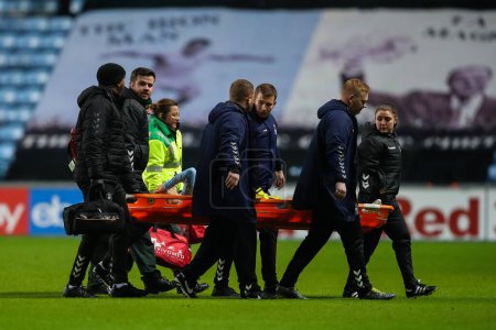 Photo for Tatsuhiro Sakamoto of Coventry City is carried off on a stretcher during the Sky Bet Championship match Coventry City vs Preston North End at Coventry Building Society Arena, Coventry, United Kingdom, 23rd February 202 - Royalty Free Image