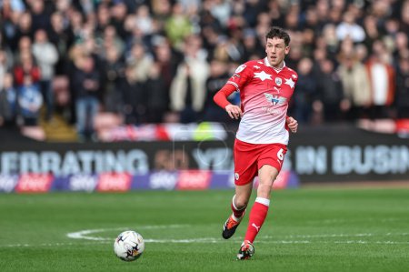 Photo for Mal de Gevigney of Barnsley with the ball during the Sky Bet League 1 match Barnsley vs Derby County at Oakwell, Barnsley, United Kingdom, 24th February 202 - Royalty Free Image