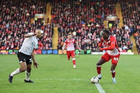 Photo for Devante Cole of Barnsley with the ball during the Sky Bet League 1 match Barnsley vs Derby County at Oakwell, Barnsley, United Kingdom, 24th February 202 - Royalty Free Image