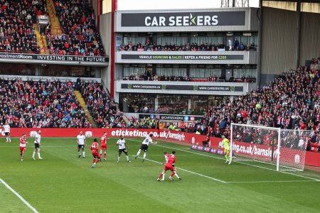 Photo for Adam Phillips of Barnsley heads on goal during the Sky Bet League 1 match Barnsley vs Derby County at Oakwell, Barnsley, United Kingdom, 24th February 202 - Royalty Free Image