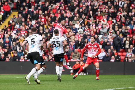 Photo for Donovan Pines of Barnsley heads on goal  during the Sky Bet League 1 match Barnsley vs Derby County at Oakwell, Barnsley, United Kingdom, 24th February 202 - Royalty Free Image