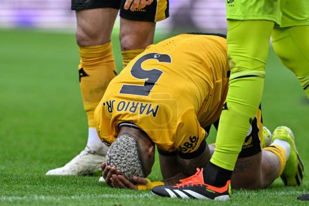 Photo for Mario Lemina of Wolverhampton Wanderers down with a head injury during the Premier League match Wolverhampton Wanderers vs Sheffield United at Molineux, Wolverhampton, United Kingdom, 25th February 202 - Royalty Free Image