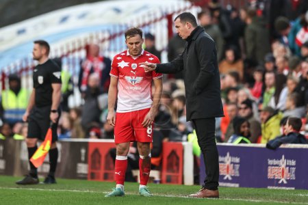 Photo for Neill Collins Head coach of Barnsley givers instruction two Herbie Kane of Barnsley during the Sky Bet League 1 match Barnsley vs Derby County at Oakwell, Barnsley, United Kingdom, 24th February 202 - Royalty Free Image