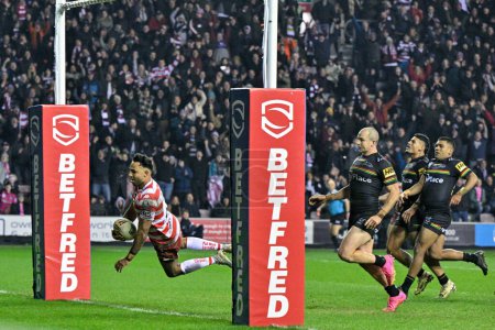 Photo for Bevan French of Wigan Warriors goes over for a try which is later disallowed, during the 2024 World Club Challenge match Wigan Warriors vs Penrith Panthers at DW Stadium, Wigan, United Kingdom, 24th February 202 - Royalty Free Image