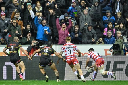 Photo for Abbas Miski of Wigan Warriors goes over for a try to make it 4-0 during the 2024 World Club Challenge match Wigan Warriors vs Penrith Panthers at DW Stadium, Wigan, United Kingdom, 24th February 202 - Royalty Free Image