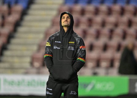 Photo for Luke Garner of Penrith Panthers inspects the pitch ahead of the match, during the 2024 World Club Challenge match Wigan Warriors vs Penrith Panthers at DW Stadium, Wigan, United Kingdom, 24th February 202 - Royalty Free Image