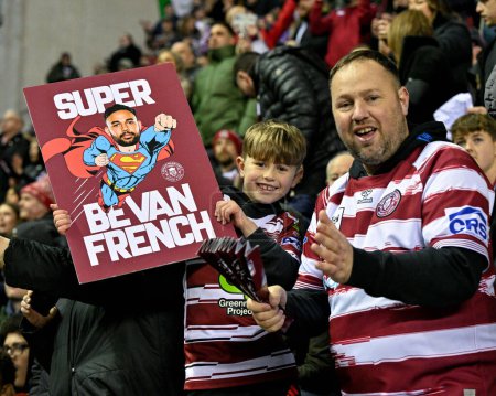 Photo for A young fans holds a Bevan French of Wigan Warriors sign ahead of the match, during the 2024 World Club Challenge match Wigan Warriors vs Penrith Panthers at DW Stadium, Wigan, United Kingdom, 24th February 202 - Royalty Free Image