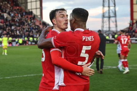 Photo for Josh Earl of Barnsley and Donovan Pines of Barnsley celebrate their 2-1 win during the Sky Bet League 1 match Barnsley vs Derby County at Oakwell, Barnsley, United Kingdom, 24th February 202 - Royalty Free Image