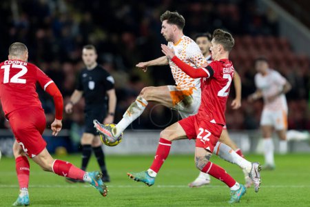 Photo for Jake Beesley of Blackpool  and Ethan Galbraith of Leyton Orient compete for the ball during the Sky Bet League 1 match Leyton Orient vs Blackpool at Matchroom Stadium, London, United Kingdom, 27th February 202 - Royalty Free Image