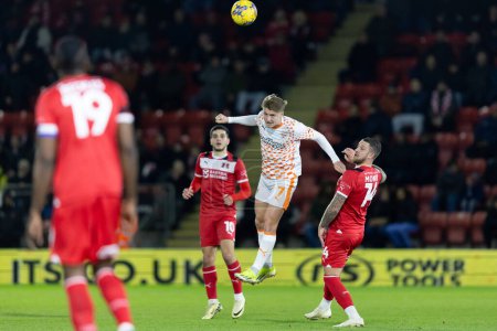 Photo for George Byers of Blackpool with a header during the Sky Bet League 1 match Leyton Orient vs Blackpool at Matchroom Stadium, London, United Kingdom, 27th February 202 - Royalty Free Image