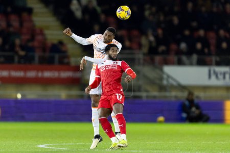 Photo for Marvin Ekpiteta of Blackpool and Shaqai Forde of Leyton Orient compete for the ball during the Sky Bet League 1 match Leyton Orient vs Blackpool at Matchroom Stadium, London, United Kingdom, 27th February 202 - Royalty Free Image