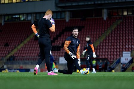 Photo for Richard O'Donnell of Blackpool and Mackenzie Chapman of Blackpool warming up prior to the Sky Bet League 1 match Leyton Orient vs Blackpool at Matchroom Stadium, London, United Kingdom, 27th February 202 - Royalty Free Image