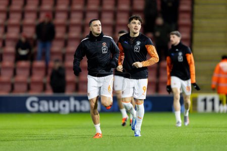 Photo for Oliver Norburn of Blackpool and Kyle Joseph of Blackpool  warming up prior to the Sky Bet League 1 match Leyton Orient vs Blackpool at Matchroom Stadium, London, United Kingdom, 27th February 202 - Royalty Free Image