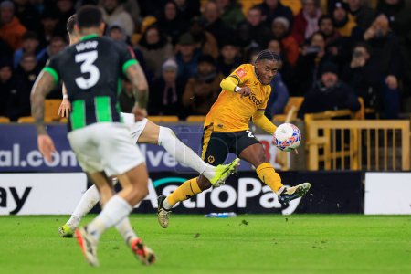 Photo for Jean-Ricner Bellegarde of Wolverhampton Wanderers crosses the ball during the Emirates FA Cup 5th Round match Wolverhampton Wanderers vs Brighton and Hove Albion at Molineux, Wolverhampton, United Kingdom, 28th February 202 - Royalty Free Image