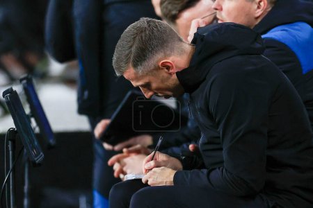 Photo for Gary O'Neill the Wolverhampton Wanderers manager makes his notes in the dug out during the Emirates FA Cup 5th Round match Wolverhampton Wanderers vs Brighton and Hove Albion at Molineux, Wolverhampton, United Kingdom, 28th February 202 - Royalty Free Image