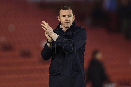 Photo for Neill Collins Head coach of Barnsley applauds the home fans during the Sky Bet League 1 match Barnsley vs Bolton Wanderers at Oakwell, Barnsley, United Kingdom, 5th March 2024 - Royalty Free Image