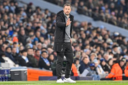 Photo for Jacob Neestrup manager of FC Copenhagen gives his team instructions during the UEFA Champions League match Manchester City vs F.C. Copenhagen at Etihad Stadium, Manchester, United Kingdom, 6th March 202 - Royalty Free Image