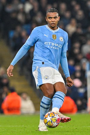 Photo for Manuel Akanji of Manchester City passes the ballduring the UEFA Champions League match Manchester City vs F.C. Copenhagen at Etihad Stadium, Manchester, United Kingdom, 6th March 202 - Royalty Free Image