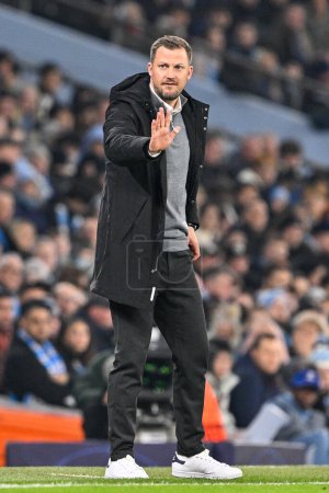 Photo for Jacob Neestrup manager of FC Copenhagen gives his team instructions during the UEFA Champions League match Manchester City vs F.C. Copenhagen at Etihad Stadium, Manchester, United Kingdom, 6th March 202 - Royalty Free Image